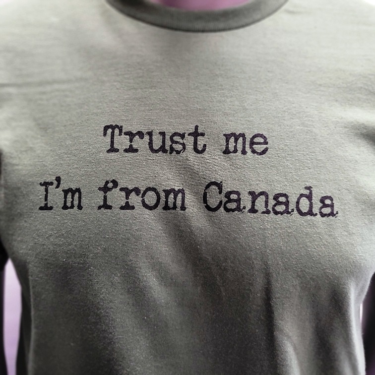 TRUST ME I'M FROM CANADA black on army green Large